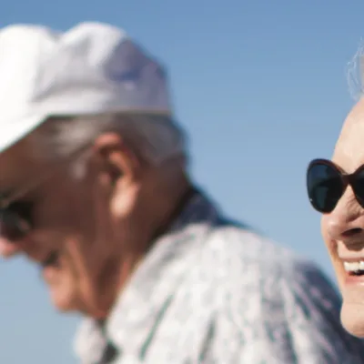 Two people walking on a sunny day