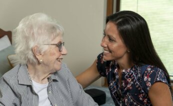 Nurse at health care center visiting a resident