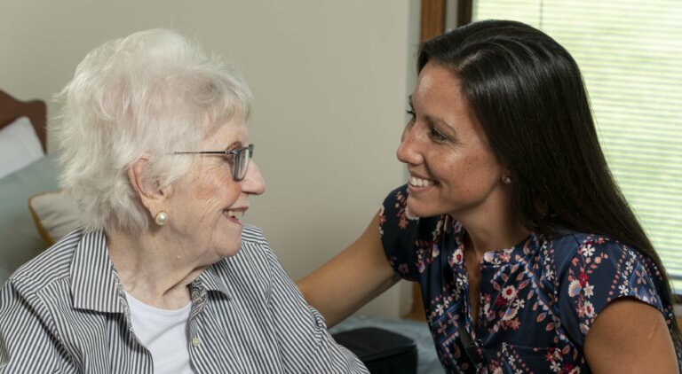 Nurse at health care center visiting a resident