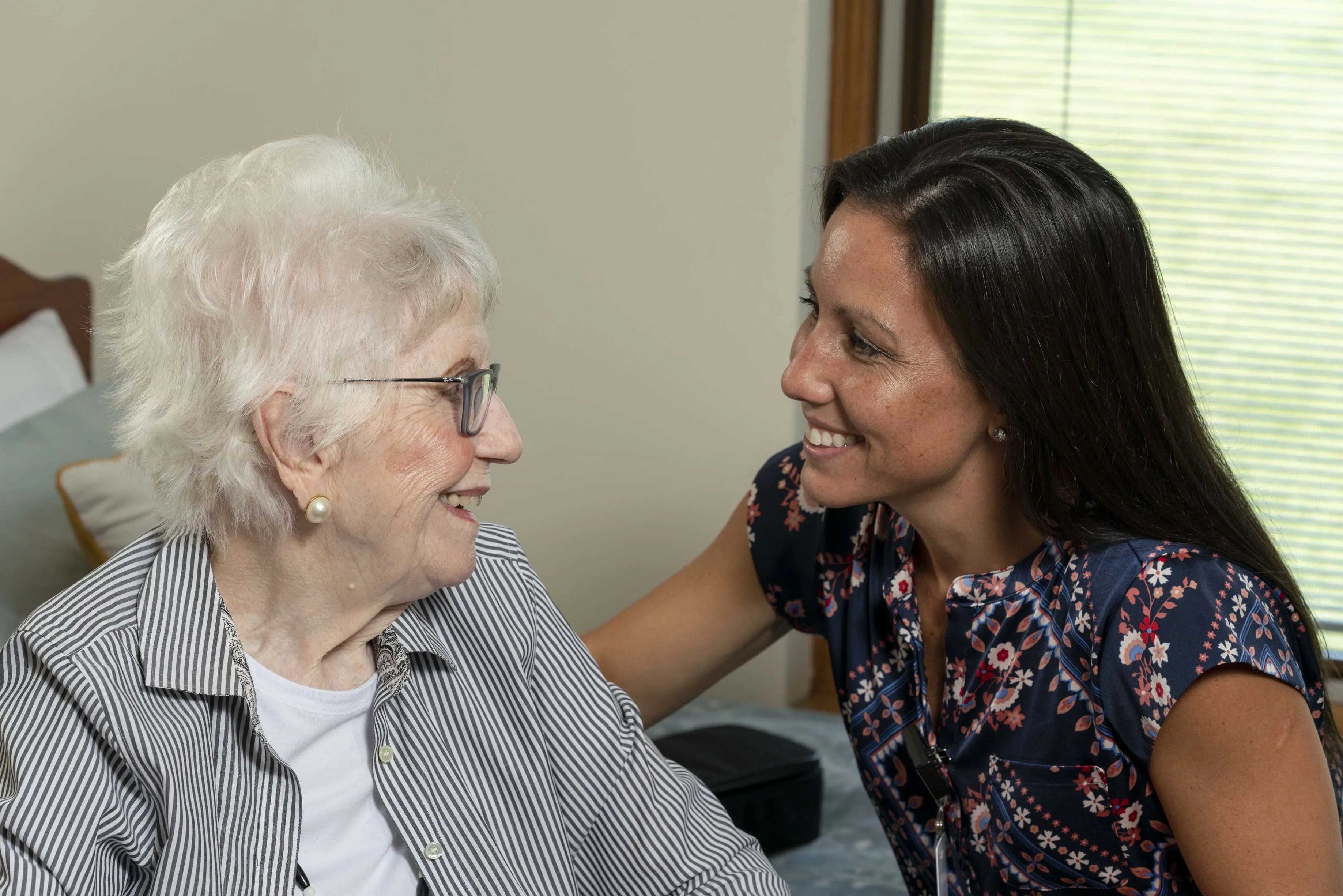 Nurse at health care center visiting a resident