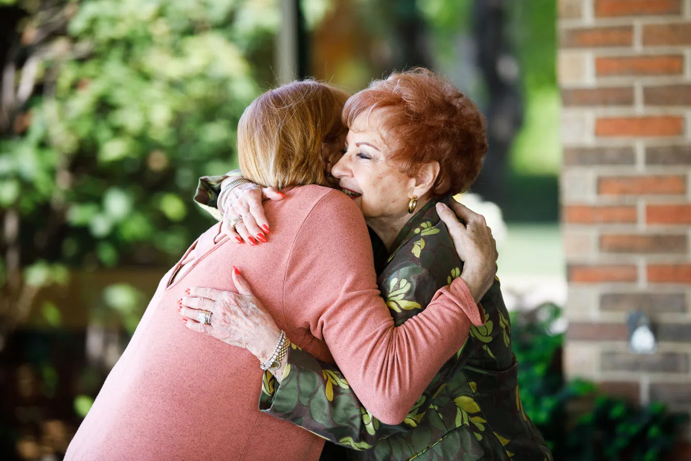 Two people embrace in a hug