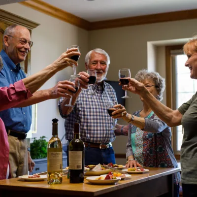 Group of residents enjoying a glass of wine