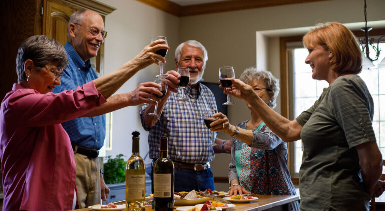 Group of residents enjoying a glass of wine