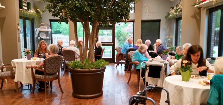 People enjoying beverages and snacks in the tea room