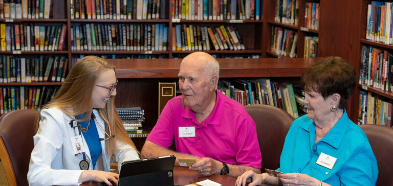 Residents talking to a nurse about preferred access