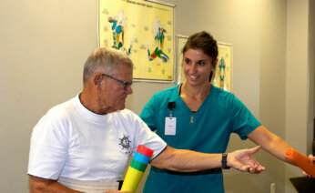 Nurse providing rehab services in transitional care
