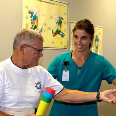 Nurse providing rehab services in transitional care