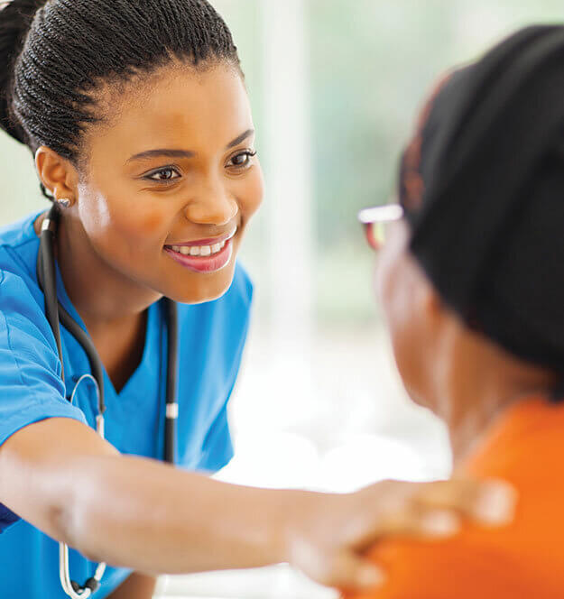 Smiling Nurse Reaching Out To Patient