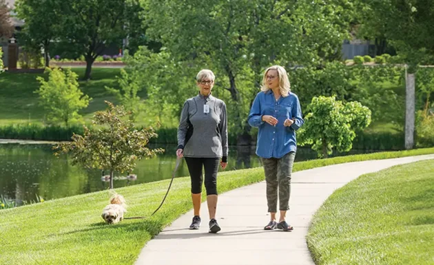 Residents walking a dog