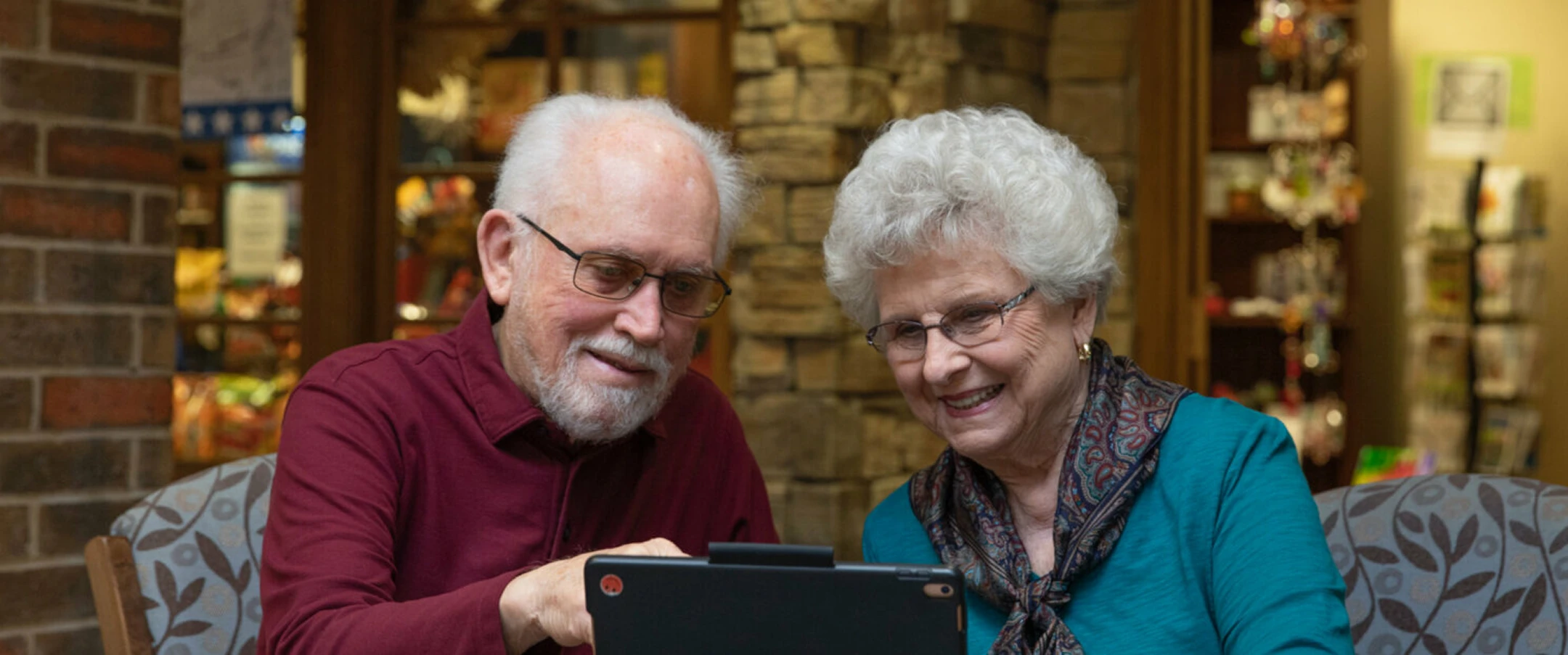 Two adults using a laptop