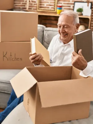 Man packing items into boxes