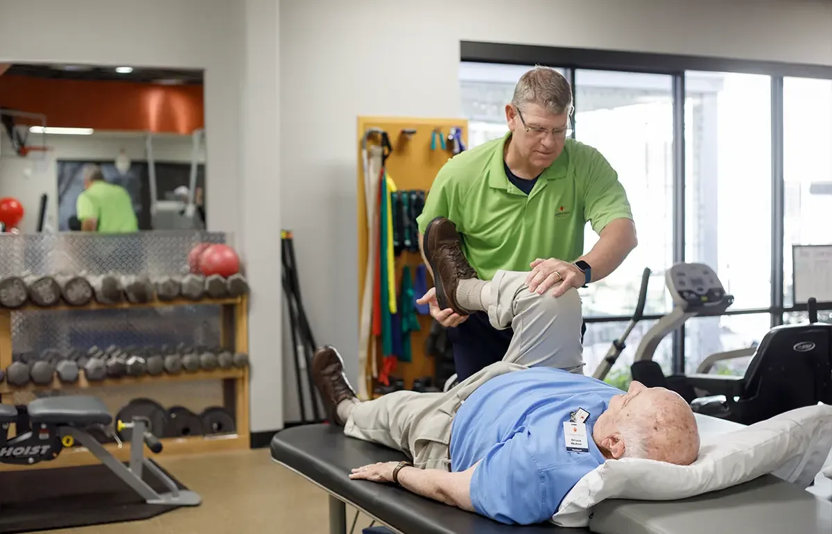 Trainer help stretch muscles