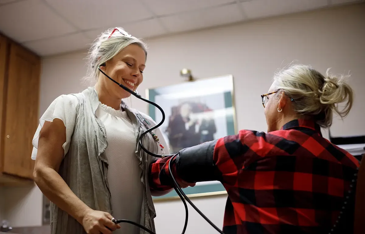 Woman taking blood pressure