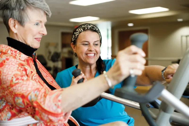 Resident using fitness machine in gym