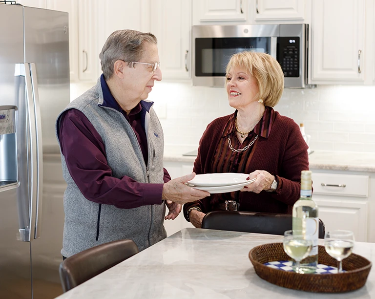 Couple at home with dishes