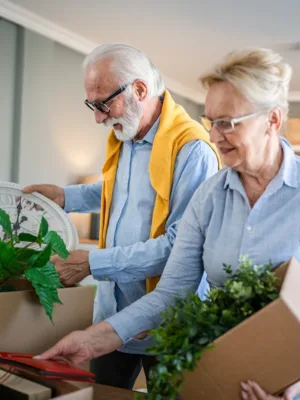 Couple packing items to move