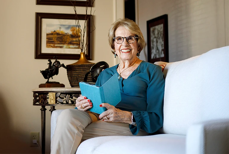 Independent living woman holding a book