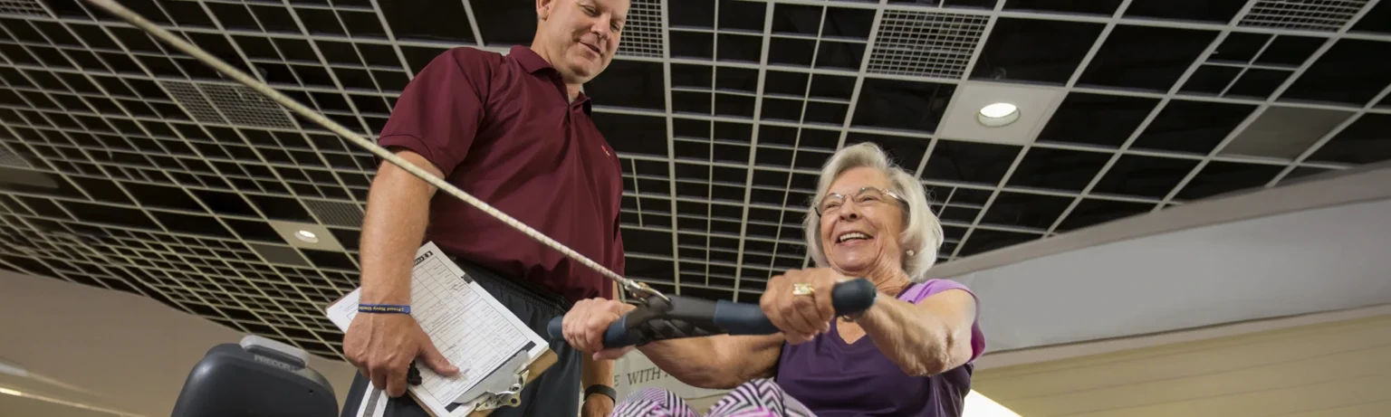 woman using rowing machine